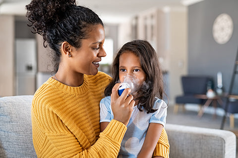 Parent Providing Asthma Treatment To Child